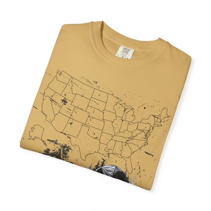 Mustard t-shirt with a black map of the United States printed on it, folded on a white background.