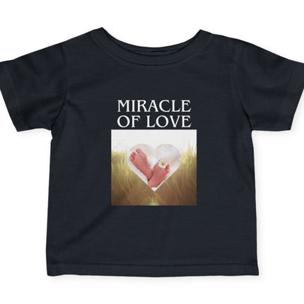 Black t-shirt with 'Miracle of Love' text and heart design on a white background