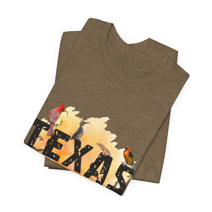 Folded green t-shirt with 'Texas' design featuring birds on a white background