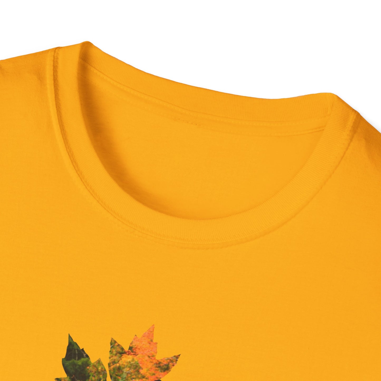 Close-up neckline of a yellow shirt with autumn leaf design on a white background