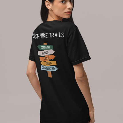 Person wearing a black t-shirt with text on the back against a gray background