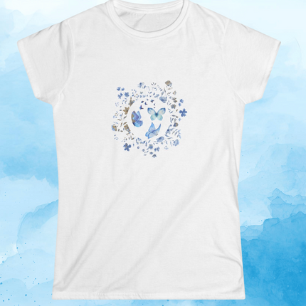 White t-shirt with butterflies and blue flowers design on a blue watercolor background
