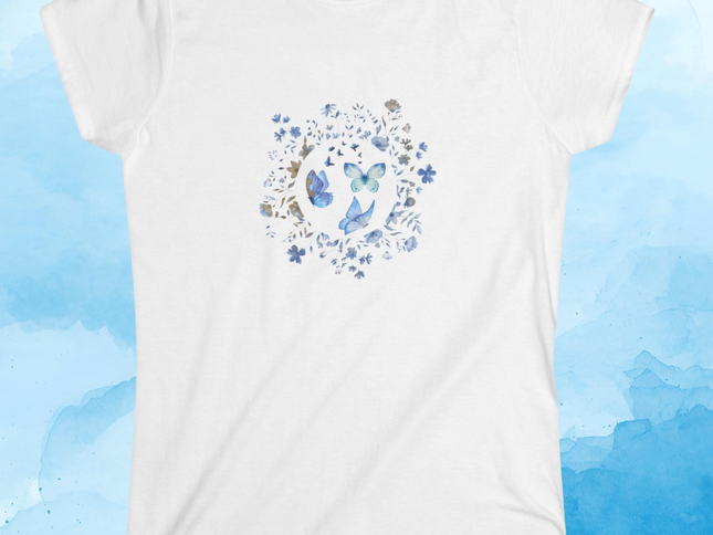 White t-shirt with butterflies and blue flowers design on a blue watercolor background