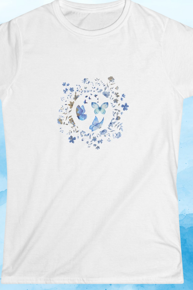 White t-shirt with butterflies and blue flowers design on a blue watercolor background