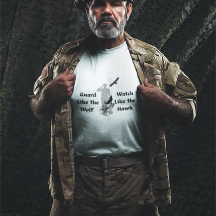 Man in military gear wearing a t-shirt with text and graphics.