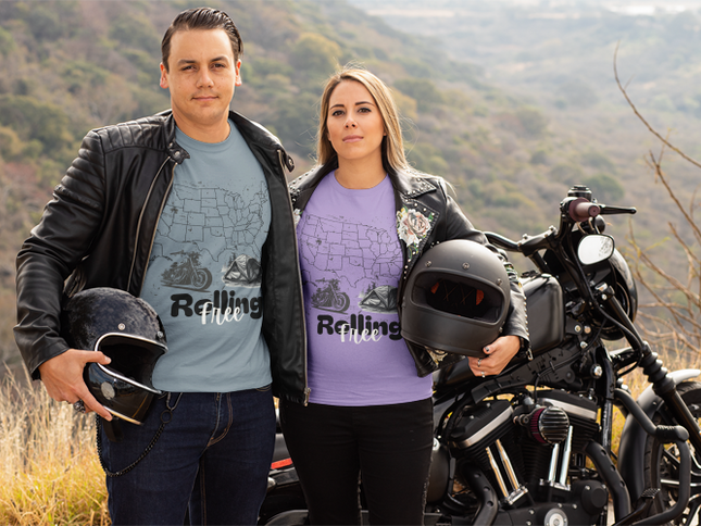 Two people standing next to a motorcycle with a scenic background